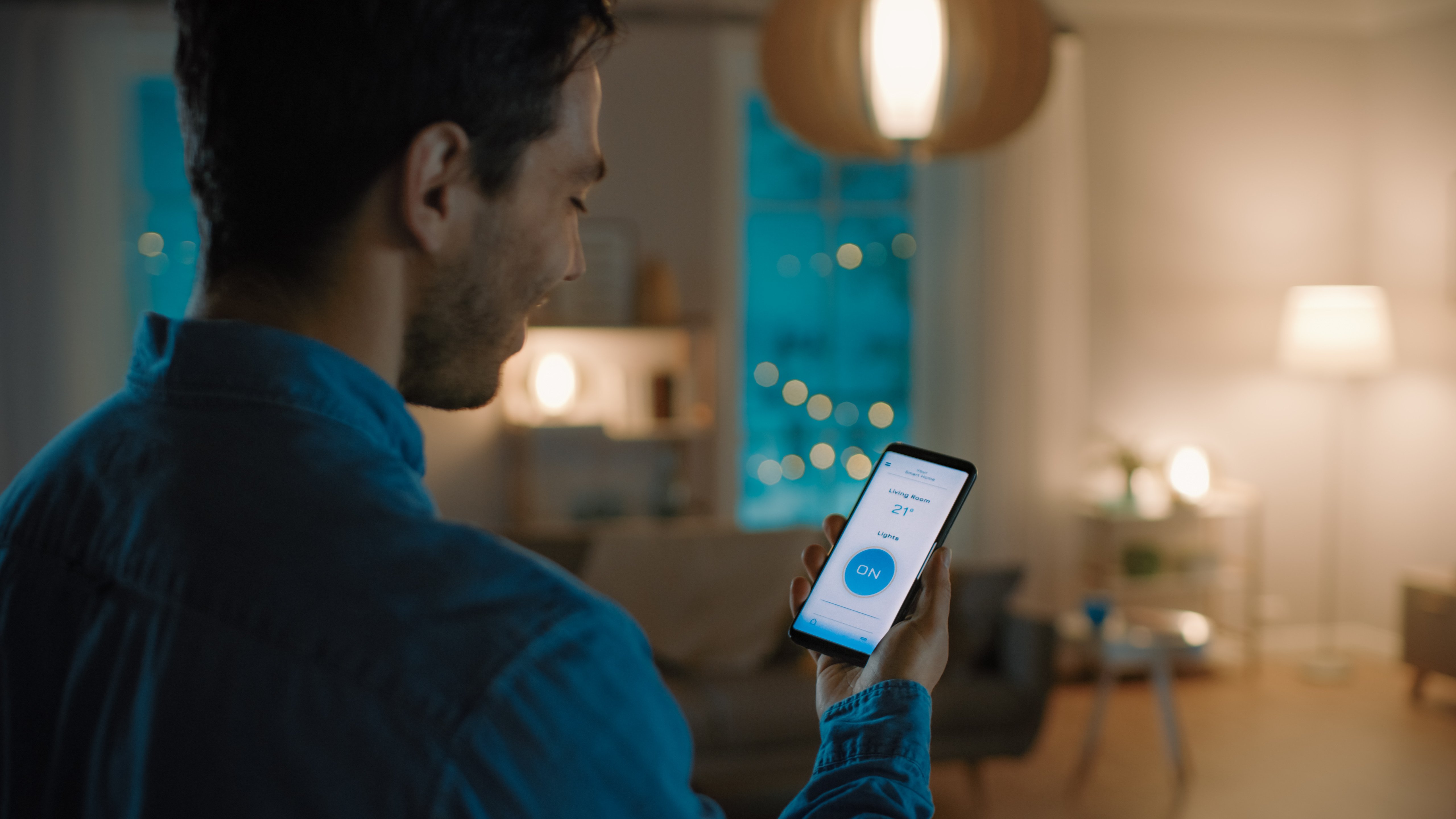 Man looking at alarm app on cell phone