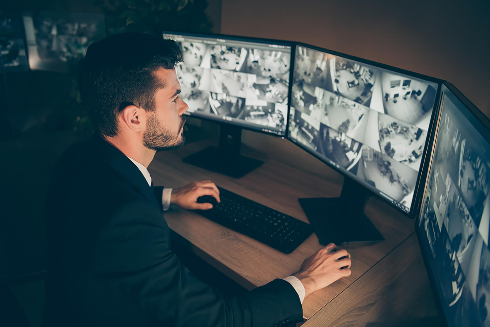 Remote Video Monitoring worker looking at screens