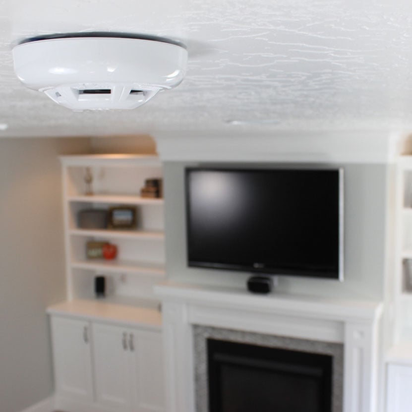 Qolsys IQ Carbon Detector on top of ceiling
