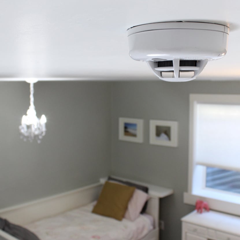 Qolsys IQ Smoke Detector on top of ceiling
