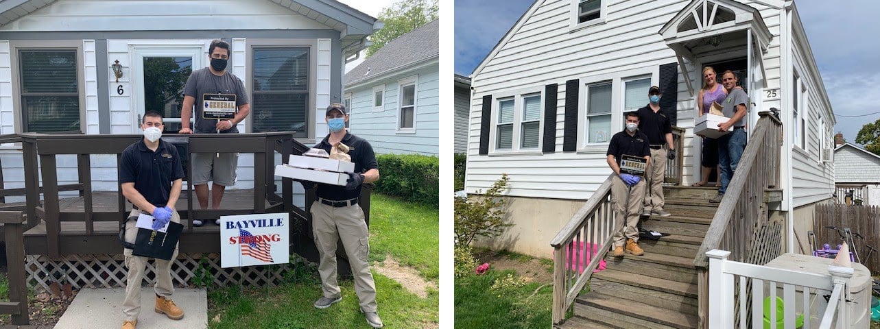 General Security employees handing out catered meals to first responders in front of their homes