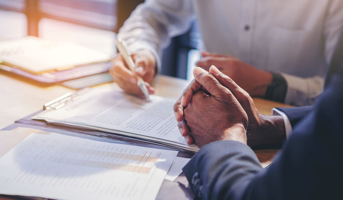 Business-people-looking-at-papers-to-make-a-deal