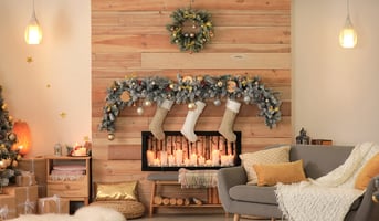 Modern living room and gas fireplace with holiday decorations
