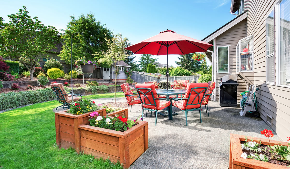 Bright spring day with backyard of patio furniture 