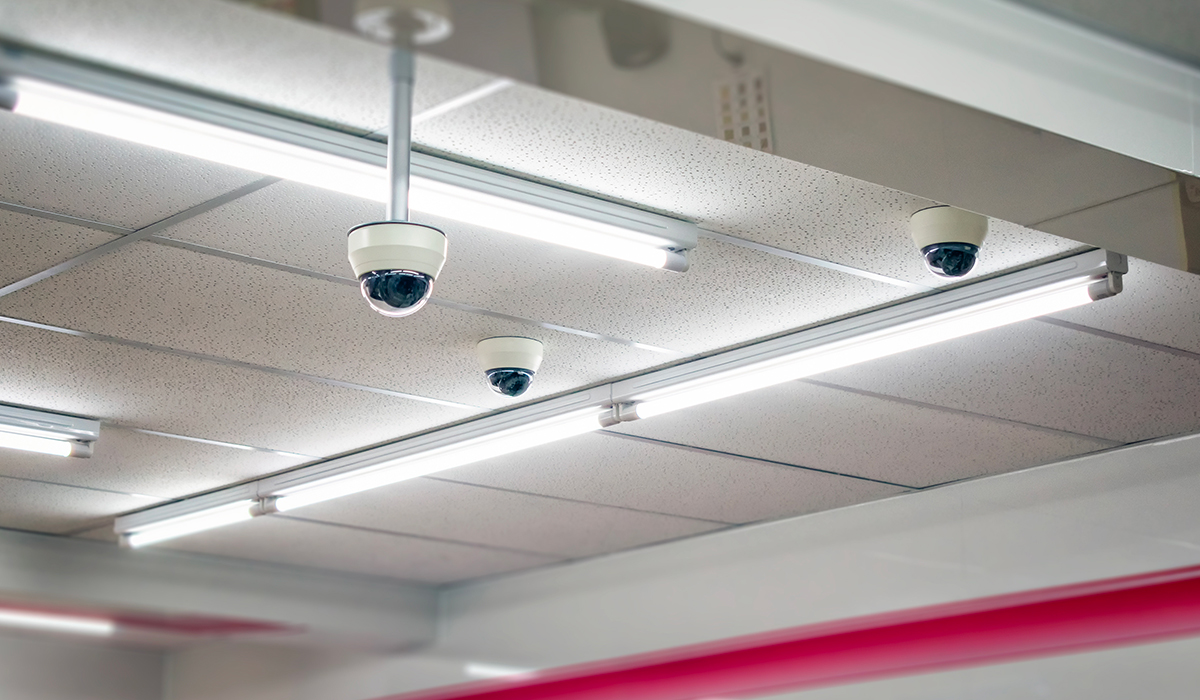 Security Cameras on ceiling of commercial building