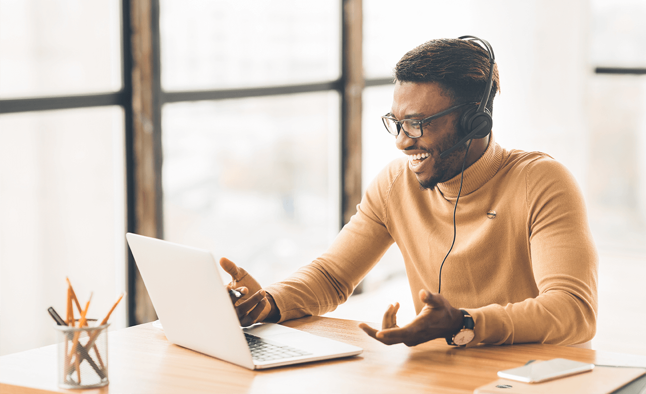 black man using laptop on a conference call